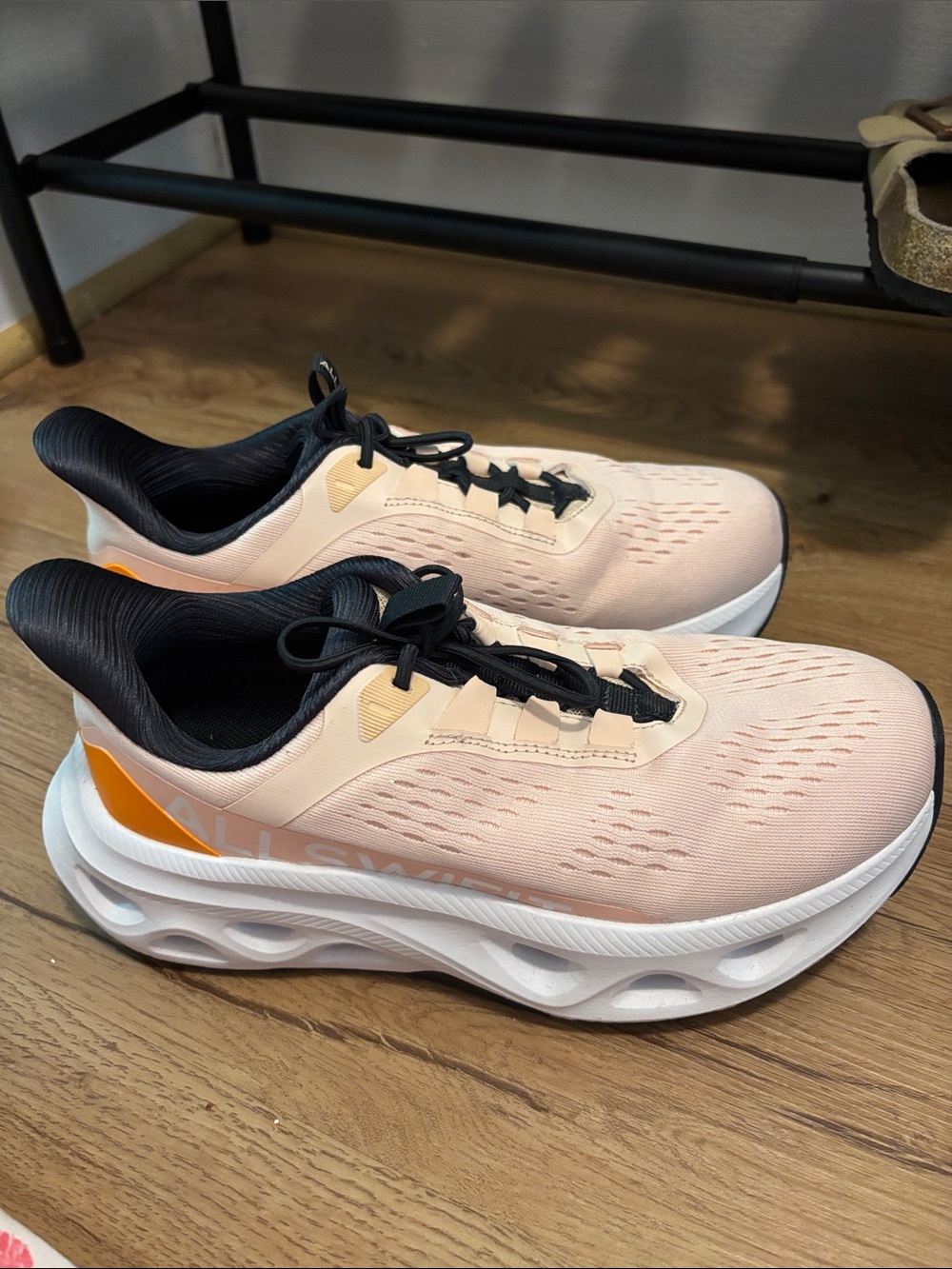 Women’s Peach Athletic Running Shoes with Black Lining and Orange Accent
